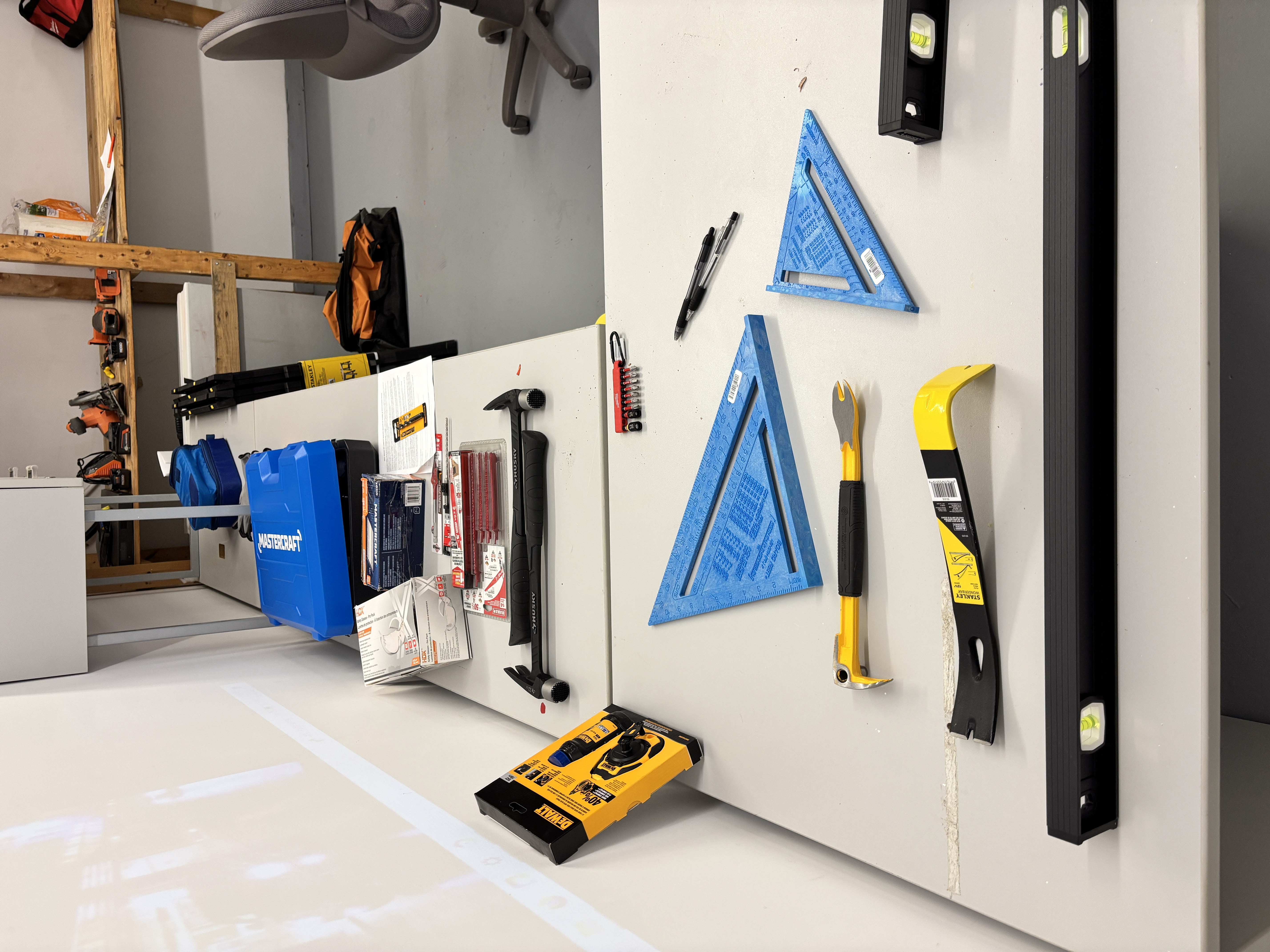 Hand tools and rafter squares on training desk